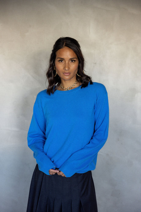 Melody wears the Ever Be Round Neck Sweater in Azure Blue form MAZU